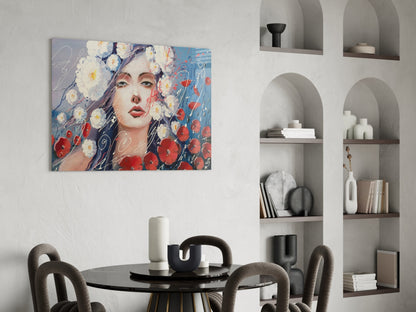 Modern dining room with colorful glass wall art depicting woman's face surrounded by red and white flowers above round black table.