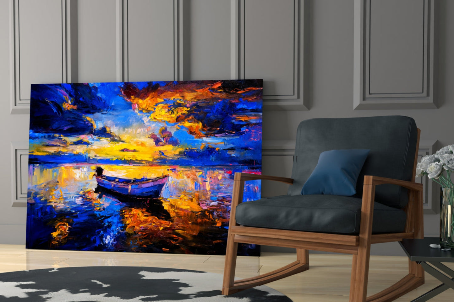 Dark blue sunset glass wall art displayed in modern living room with wooden chair and white flowers.