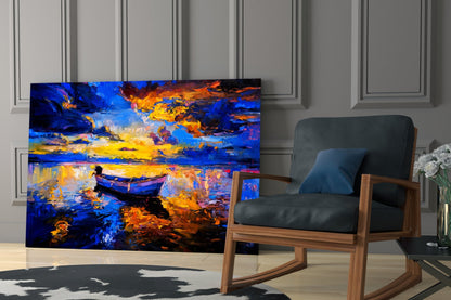Dark blue sunset glass wall art displayed in modern living room with wooden chair and white flowers.