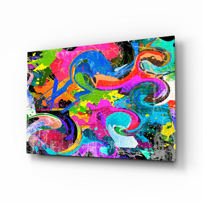 Vibrant multicolored glass wall art with abstract swirling patterns in neon pink, blue, green, yellow, and orange on black background, displayed at an angle.