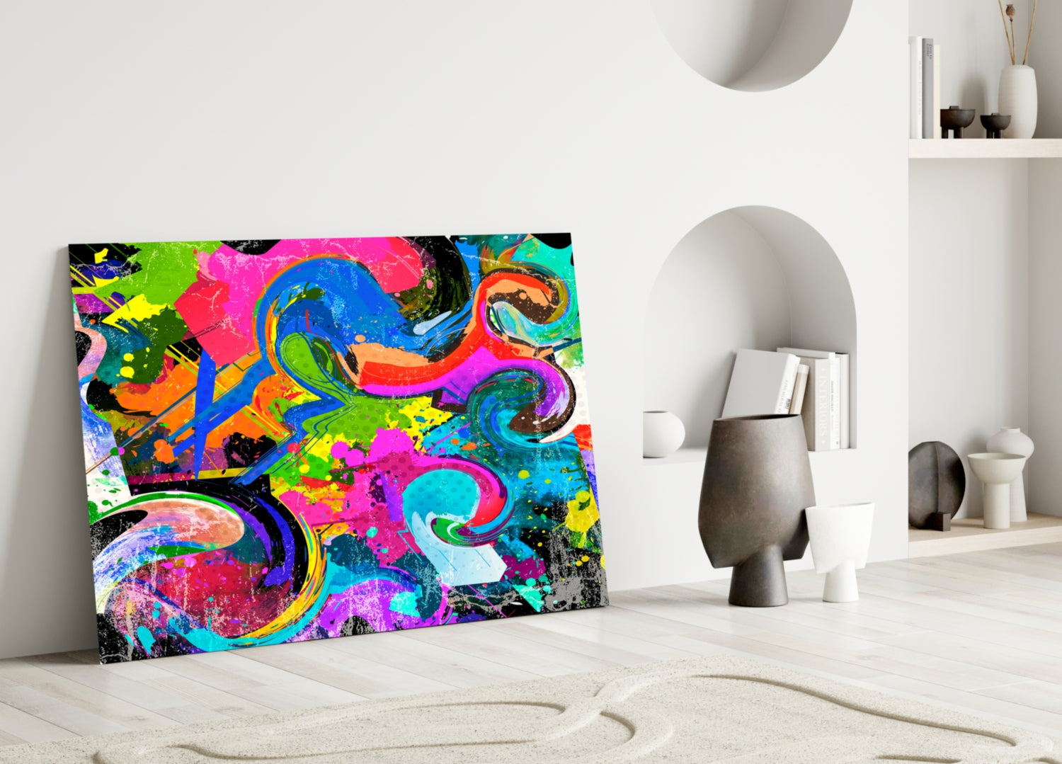 Vibrant Ebruli glass wall art with neon pink, blue, green, and yellow abstract swirls displayed against white wall in minimalist interior.
