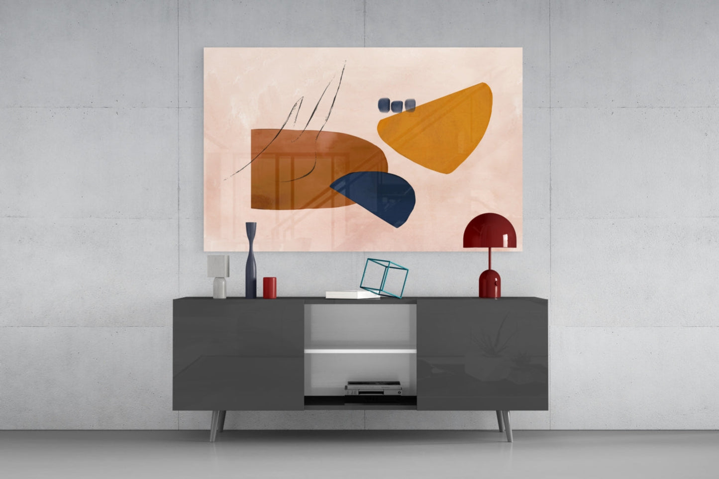 Abstract brown glass wall art featuring geometric shapes in gold, navy, and burgundy displayed above a dark gray media console.