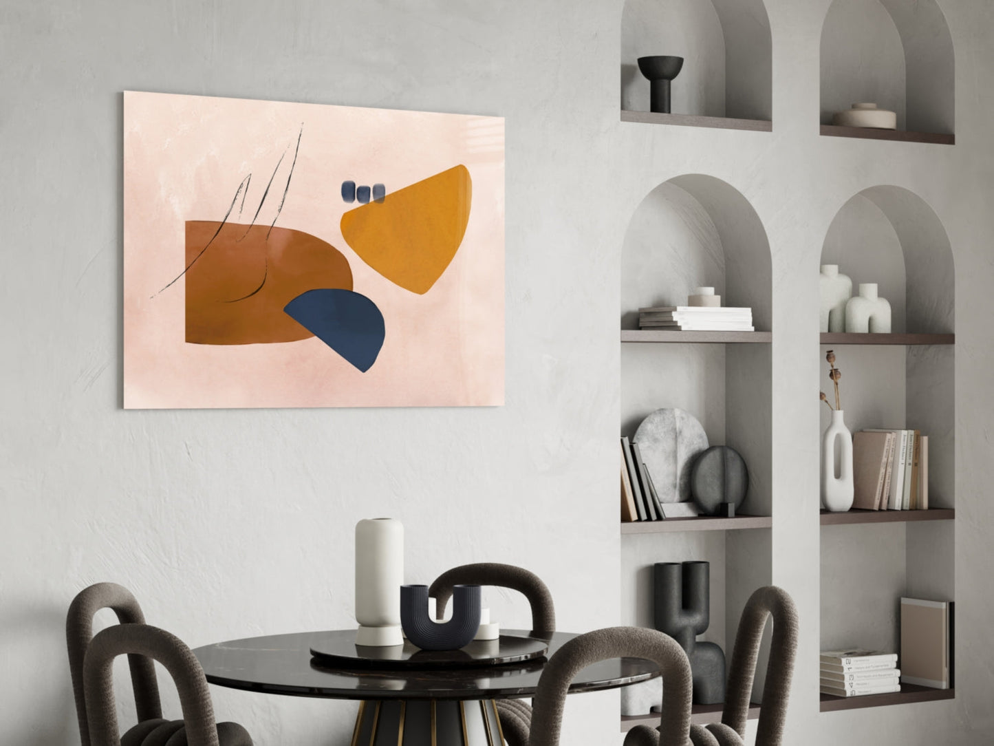 Abstract glass wall art with brown, navy, and golden yellow geometric shapes on pale pink background, displayed above dining table.