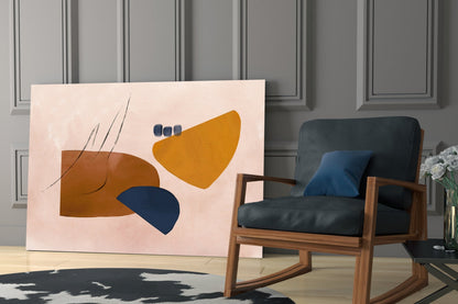 Abstract brown glass wall art featuring geometric shapes in brown, gold, and navy blue displayed in a modern living room setting.