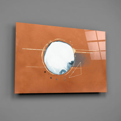 Orange glass wall art with circular mirror center, gold leaf lines, and geometric sketched details, mounted on gray wall.