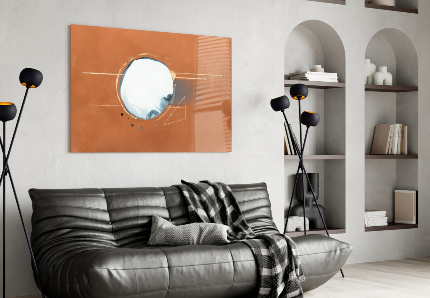 Abstract Cinnamon Glass Wall Art displayed above black leather sofa in modern living room with built-in shelving.