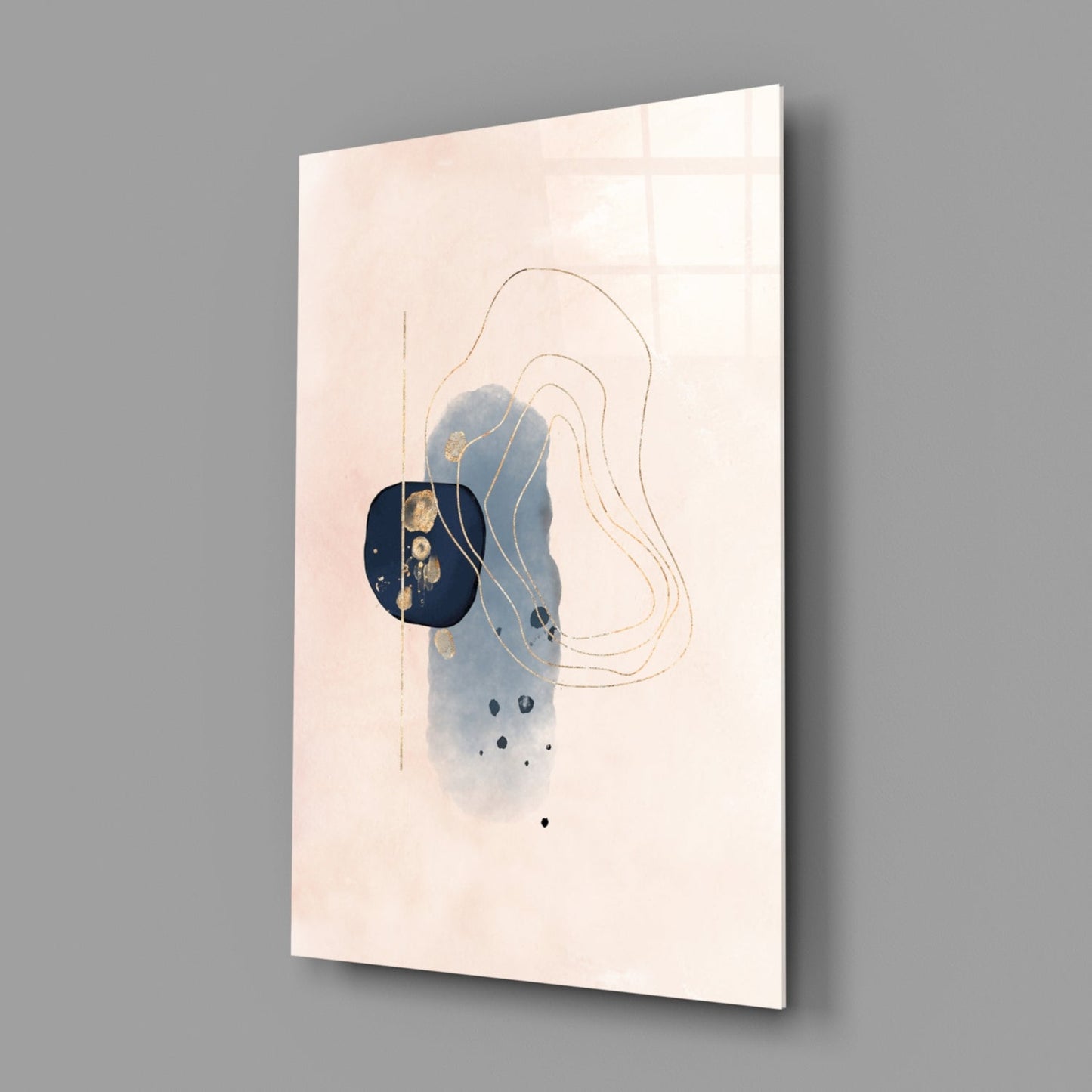Abstract beige glass wall art displayed at an angle, showing blue watercolor wash, gold leaf accents, tan line drawings, and black dots on cream background.