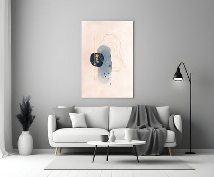 Abstract beige glass wall art with blue watercolor and line drawings displayed above a white sofa in a modern living room.