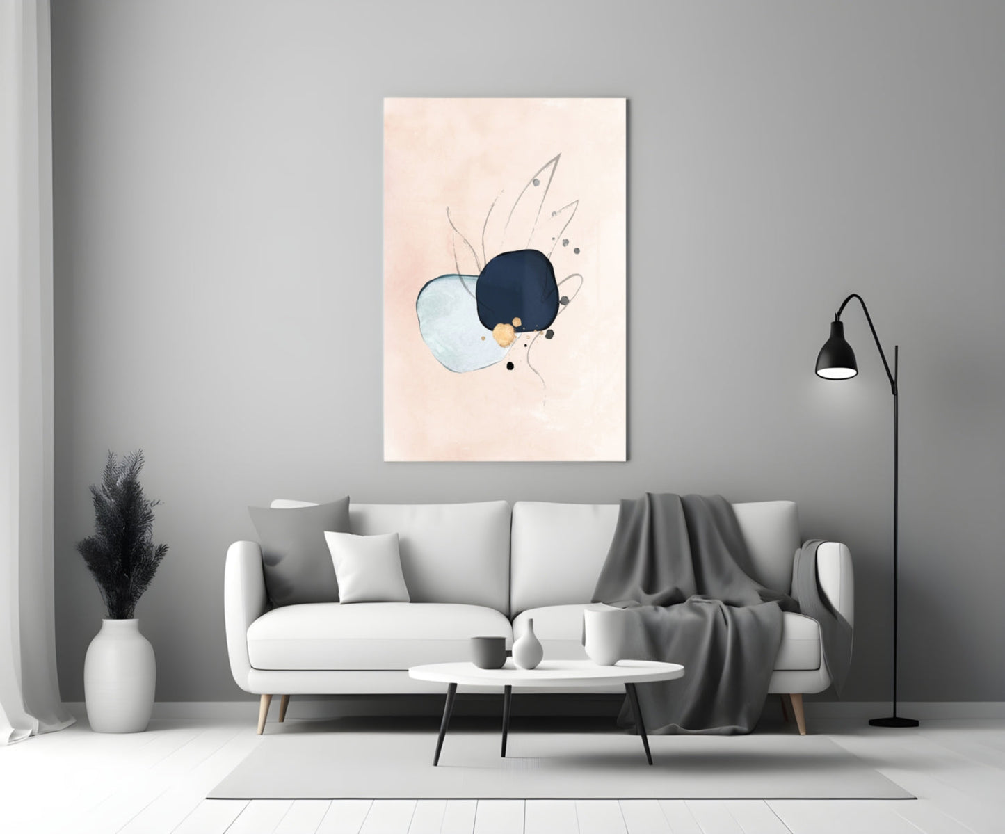 Abstract hand glass wall art with navy, light blue, and peach tones displayed above white sofa in modern living room.