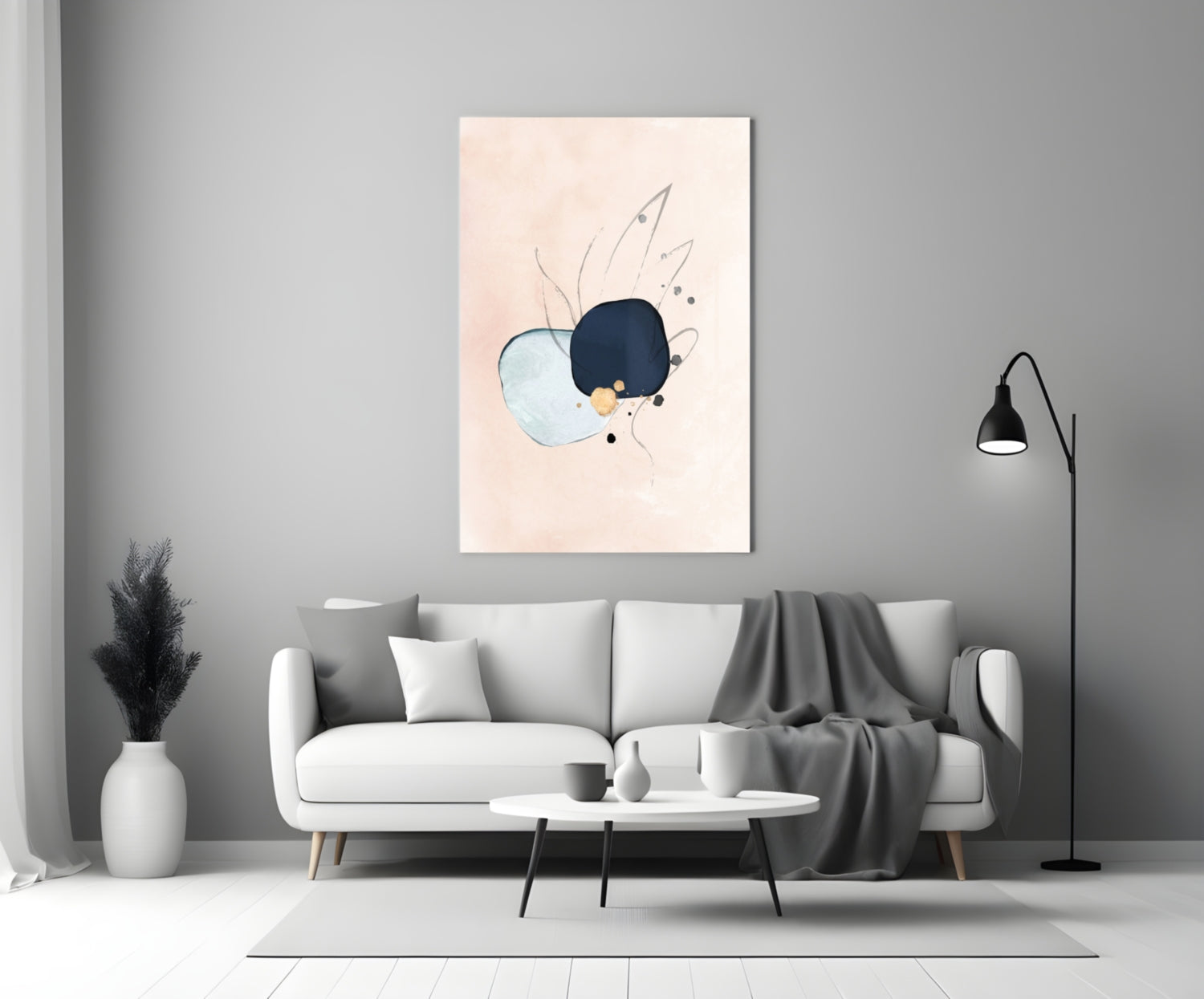 Abstract hand glass wall art with navy, light blue, and peach tones displayed above white sofa in modern living room.