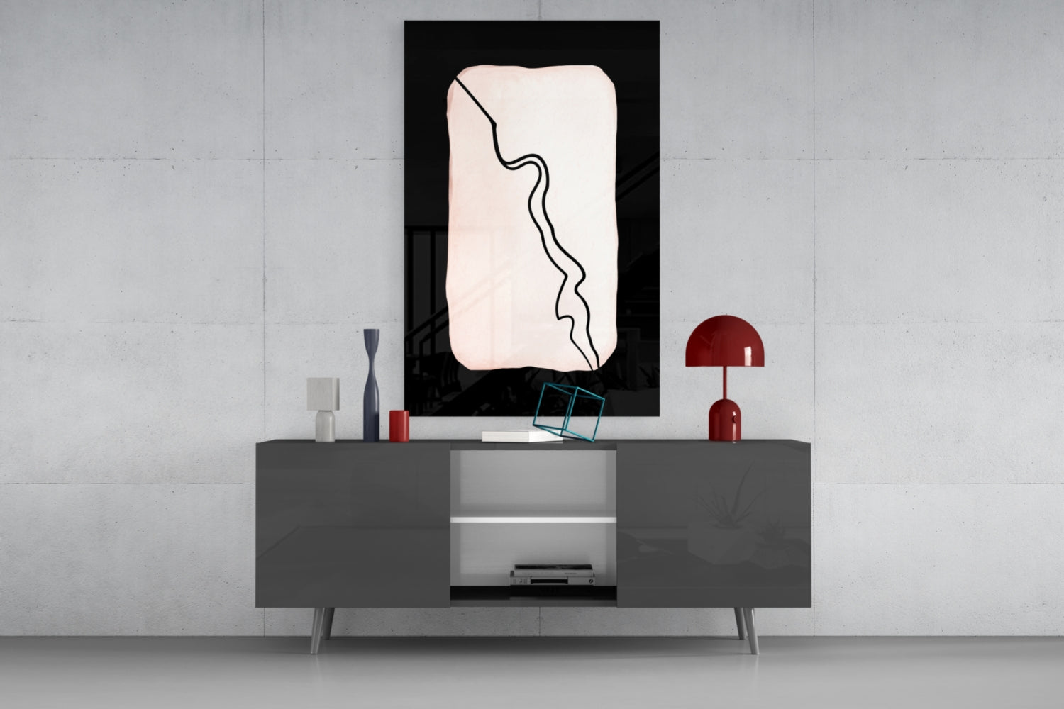 Modern living room interior with abstract black and white glass wall art displayed above gray console table with red accents.