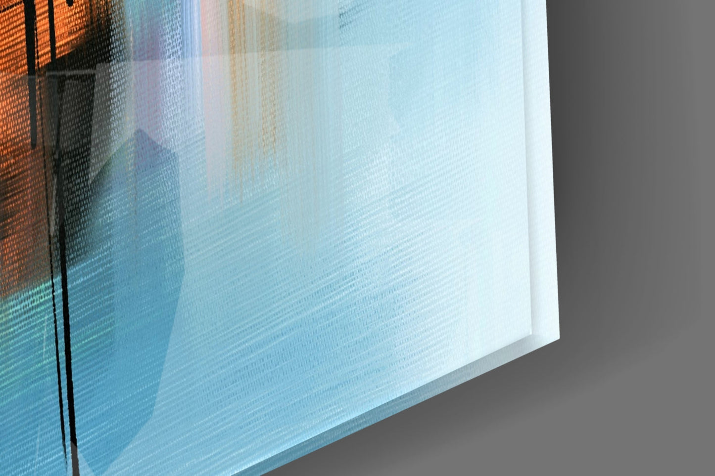Close-up angled view of layered glass art showing orange, blue, and white translucent panels with textured surfaces.