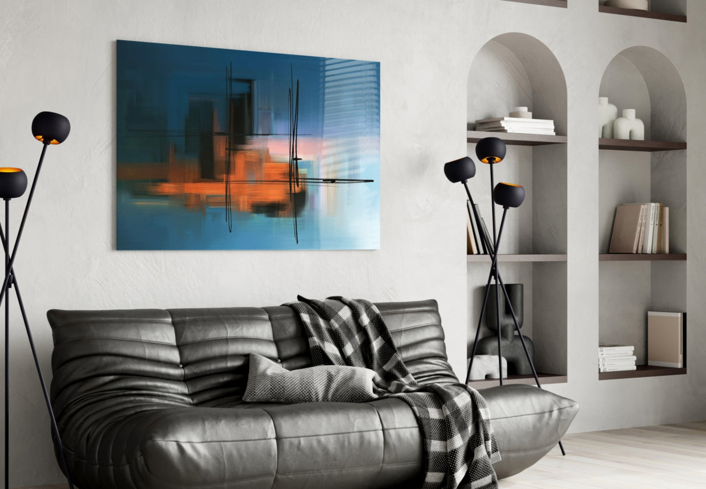 Modern living room with blue and orange abstract glass artwork hung above a gray leather sofa with black decorative lamp.