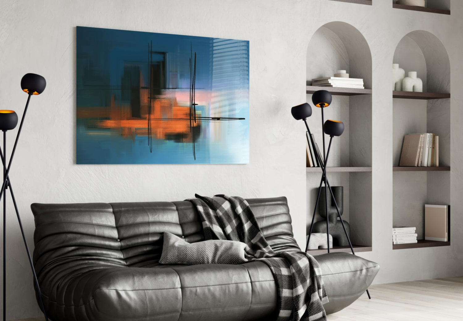 Modern living room with blue and orange abstract glass artwork hung above a gray leather sofa with black decorative lamp.