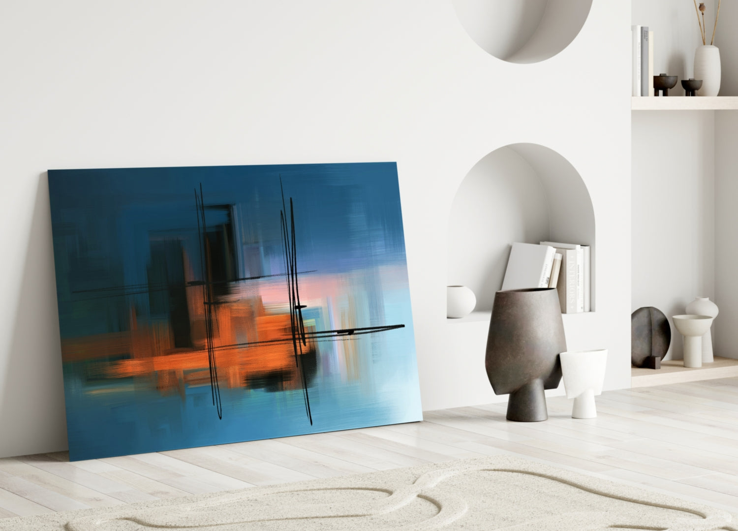Abstract Silhouette Glass Wall Art leaning against white wall displaying blue, orange, and black brushstroke design in modern interior setting.