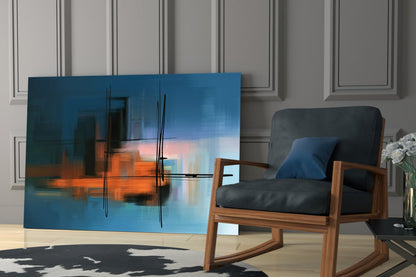 Abstract Silhouette Glass Wall Art displaying blue sky and orange sunset cityscape with black linear details displayed in modern living room setting.
