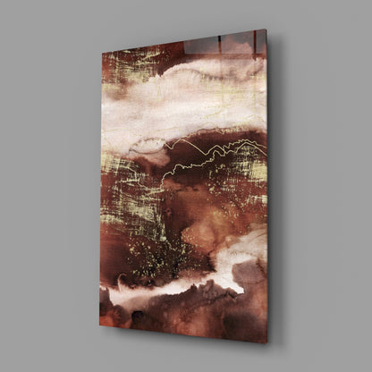 Abstract Earth Glass Wall Art displayed at an angle, featuring layered rust, cream, and gold tones with wavy line details.