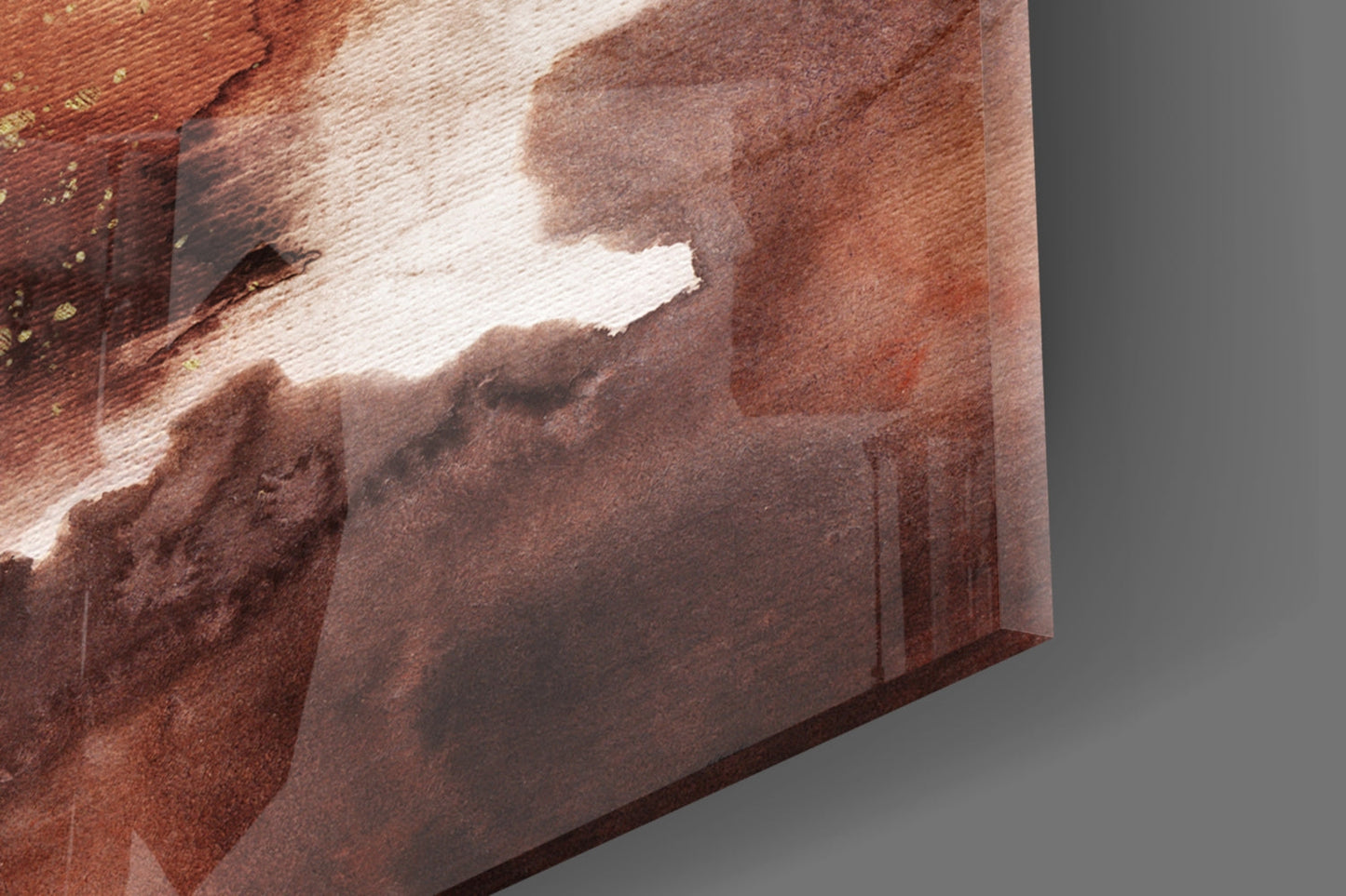 Close-up angled view of abstract glass wall art showing layered brown, cream, and rust tones with textured surface detail.