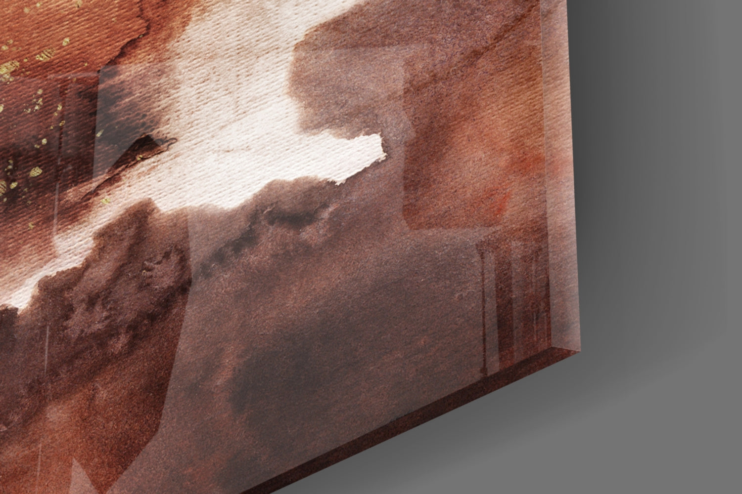Close-up angled view of abstract glass wall art showing layered brown, cream, and rust tones with textured surface detail.