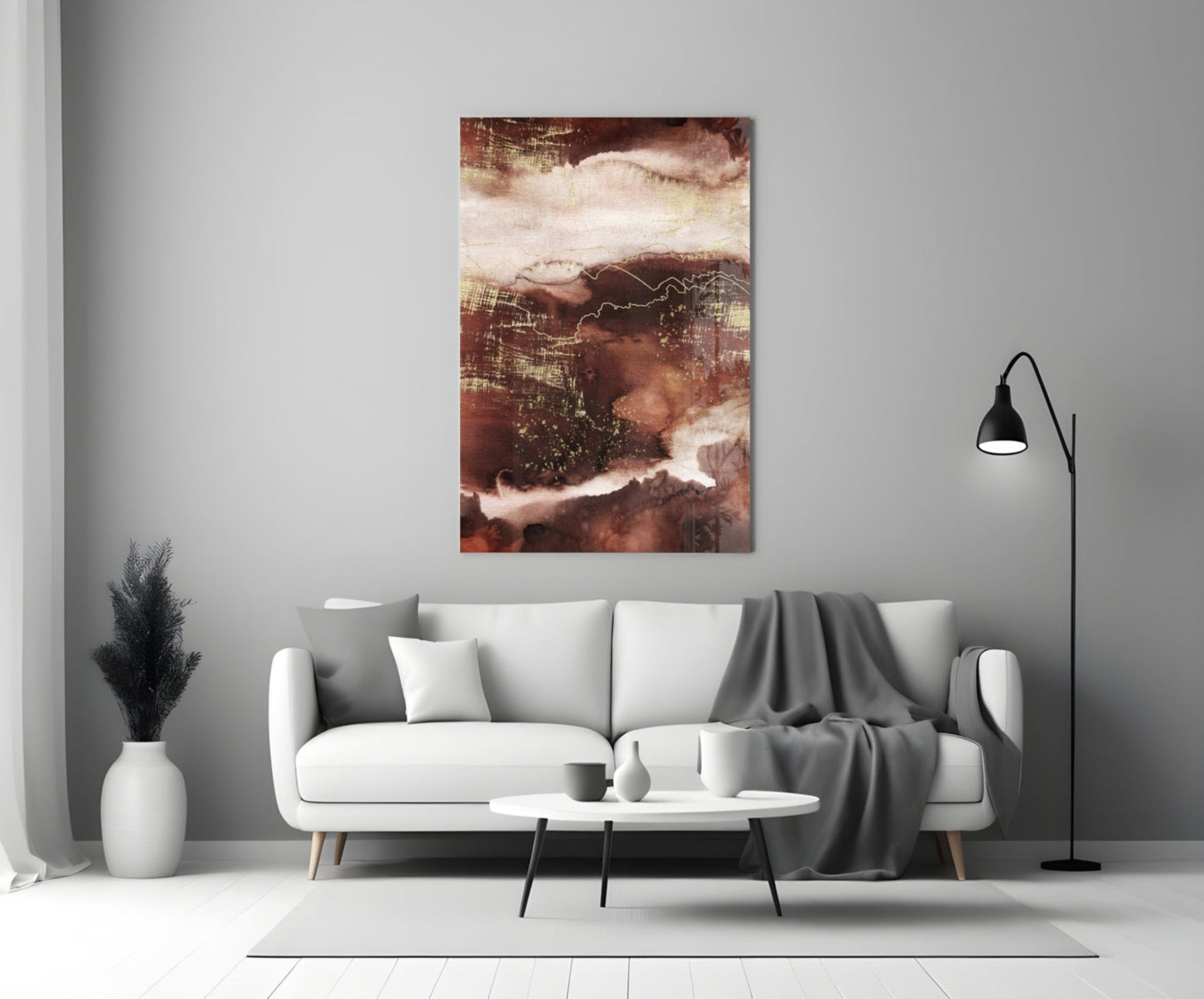 Abstract Earth Glass Wall Art in warm brown and cream tones displayed above a white sofa in a modern living room.