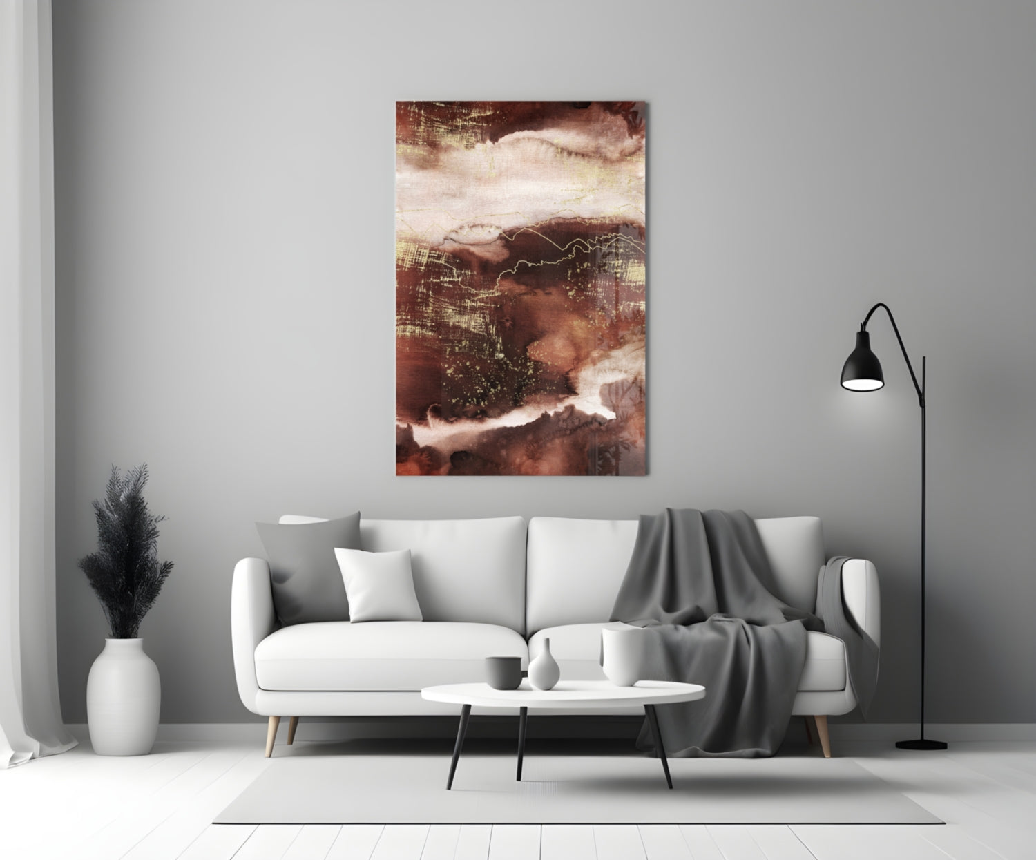 Abstract Earth Glass Wall Art in warm brown and cream tones displayed above a white sofa in a modern living room.