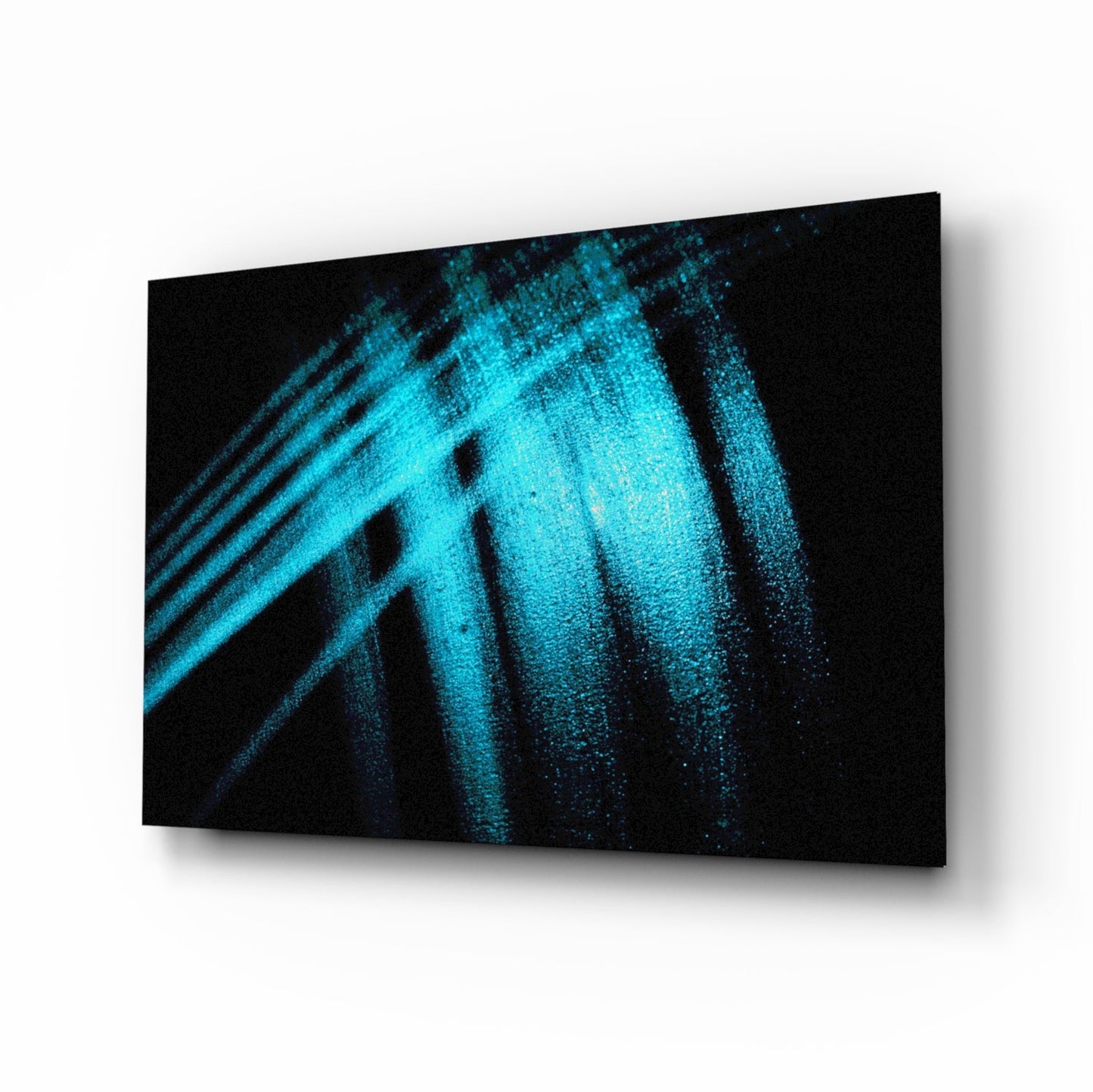 Three-dimensional perspective view of glass wall art displaying bright turquoise light streaks and particles against black background.