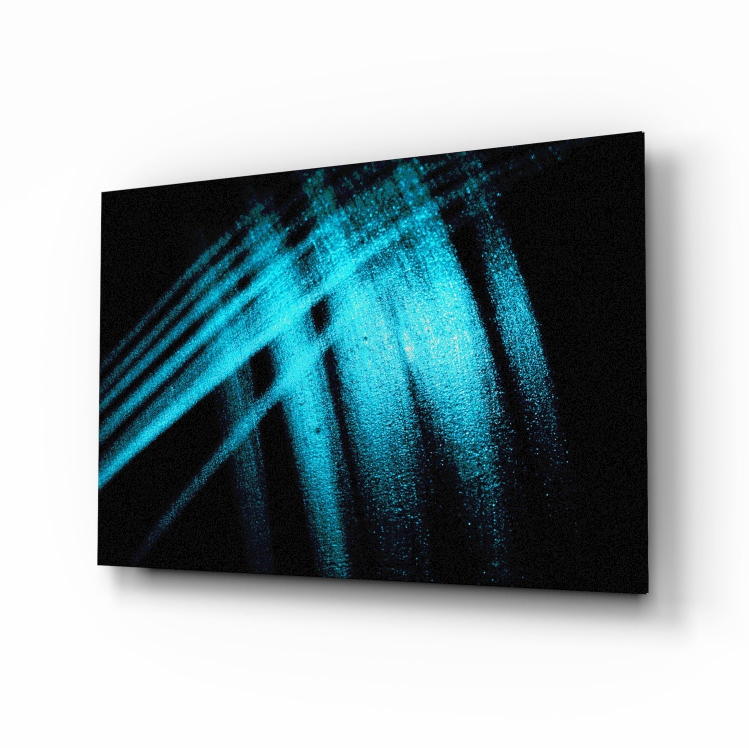 Three-dimensional perspective view of glass wall art displaying bright turquoise light streaks and particles against black background.