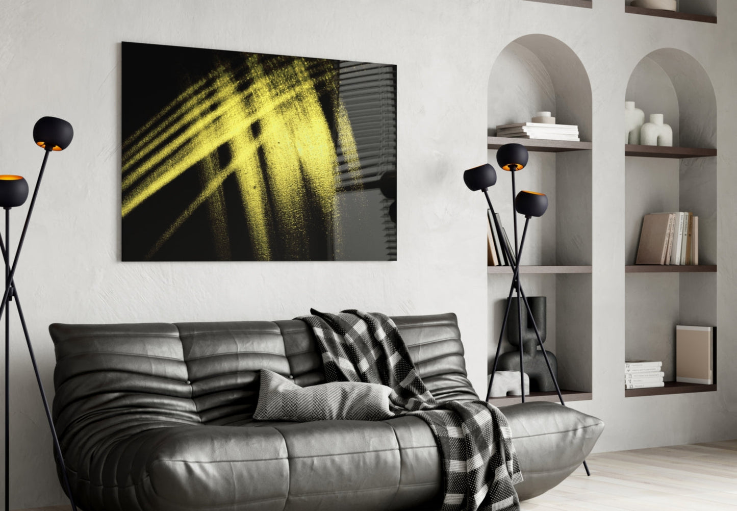 Yellow Lights Glass Wall Art displayed above a black leather sofa in a modern living room with built-in shelving.