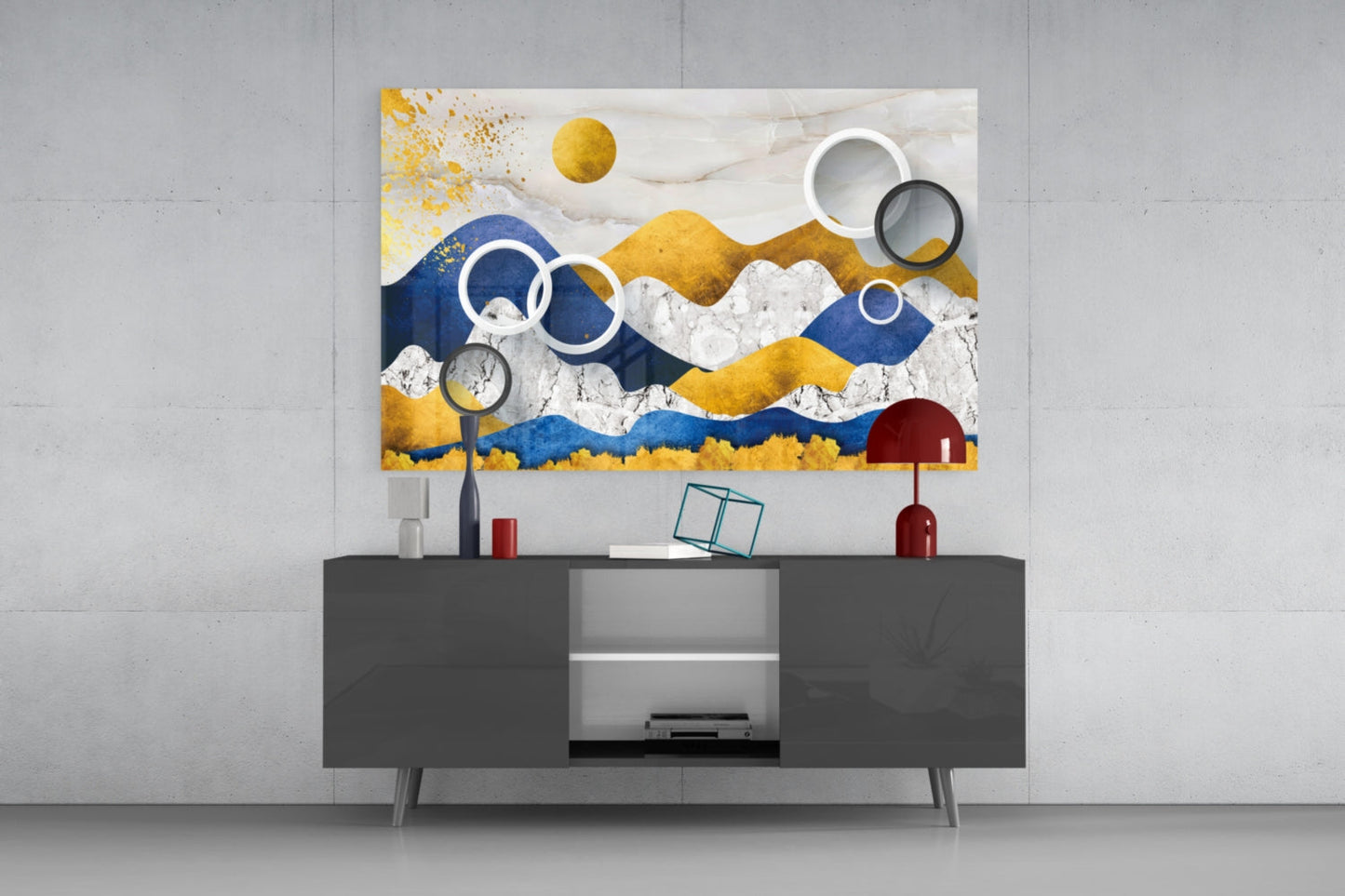 Modern living room with colorful abstract mountain glass wall art in blue, gold, and white displayed above dark gray TV console.