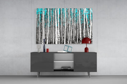 Blue Forest Glass Wall Art featuring birch trees with turquoise sky displayed above gray media console in modern interior setting.