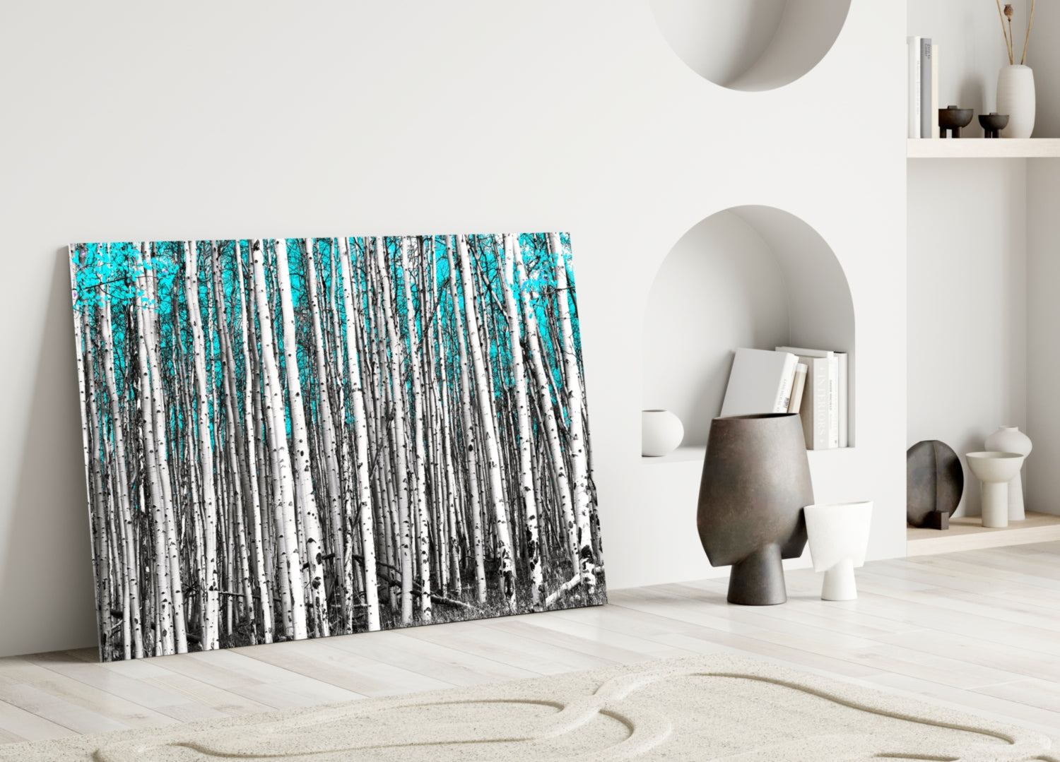 Blue Forest Glass Wall Art leaning against white wall in minimalist interior with decorative objects and alcoves.