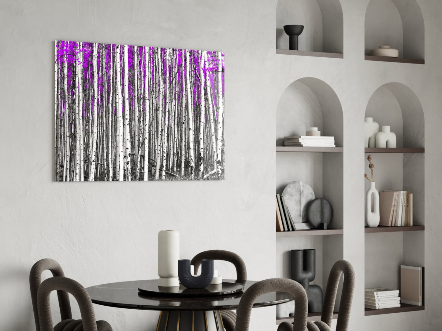 Purple and gray birch forest glass wall art displayed above a round black dining table with gray upholstered chairs.