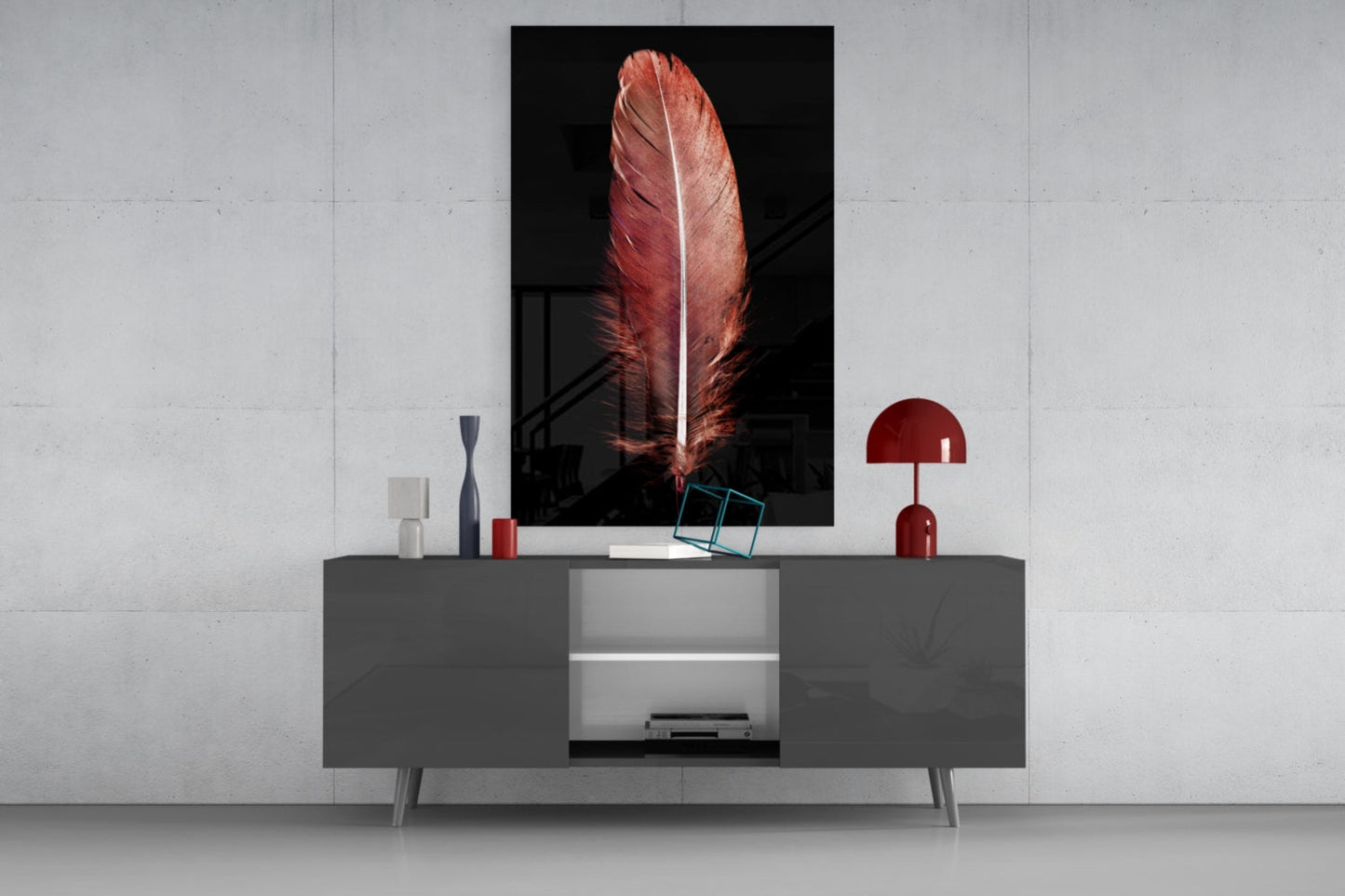 Red feather glass wall art displayed above gray media console with decorative items in modern living room setting.