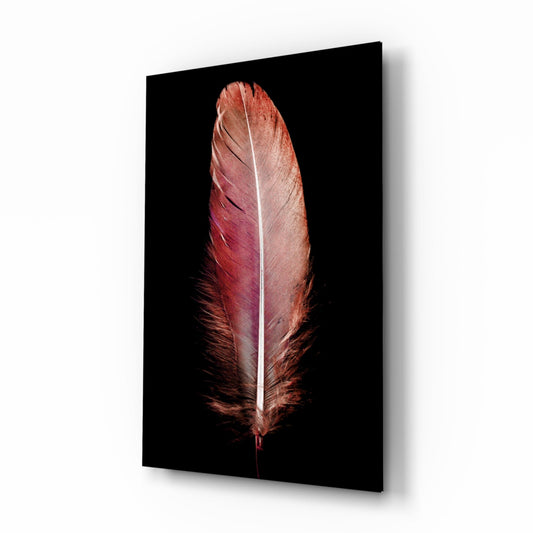 A single red and copper feather with white central spine centered against a black background on glass tile.