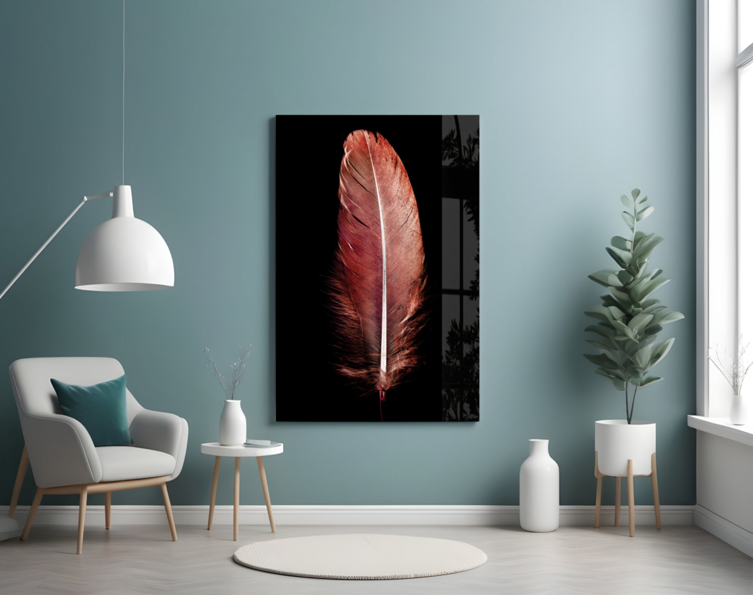 Red feather glass wall art displayed on teal wall above white chair in modern minimalist interior.