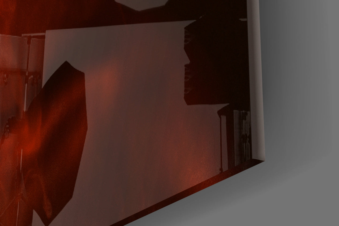 Red glass wall art with silhouetted woman figure and smoke effect, installed in corner interior space.