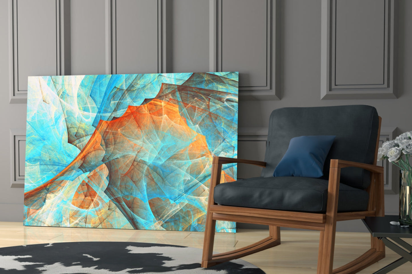Abstract glass wall art in turquoise and orange tones displayed beside mid-century wooden chair in modern interior setting.