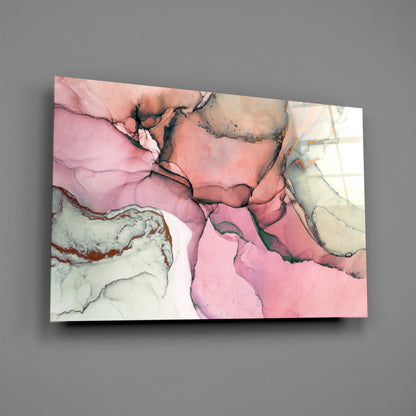 Glass wall art mounted on gray wall displaying pink, cream, and gold marble swirls with black veining details.