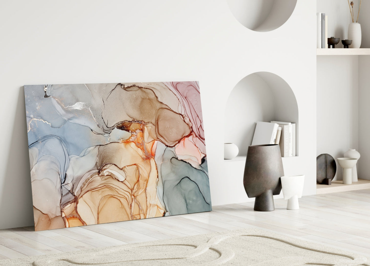 Abstract marble glass art with blue, orange, and pink fluid patterns leaning against white wall in minimalist interior.