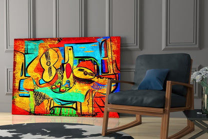 Vibrant abstract glass wall art featuring colorful guitars and musical instruments in red, yellow, blue, and green tones displayed in a modern living room setting.