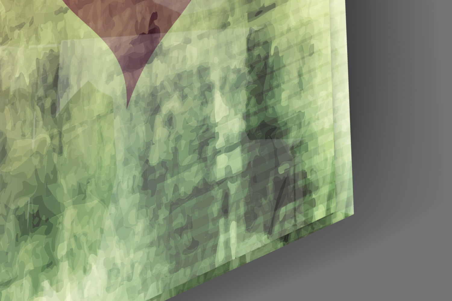 Close-up angled view of translucent green glass wall art with layered heart cutouts and burgundy accent, showing surface texture and depth.