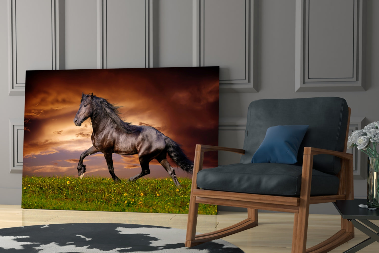 Black horse galloping across green meadow with dramatic orange sunset sky on glass panel displayed in modern living room.