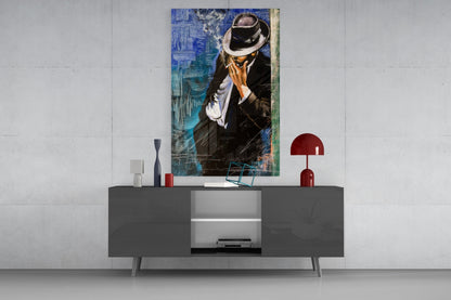 Smoking Glass Wall Art depicting a man in black suit and fedora hat against blue textured background, displayed above gray media console in modern interior.