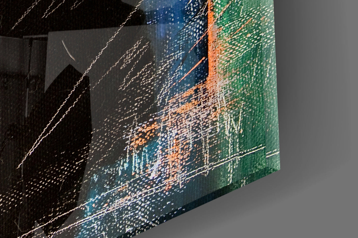 Angled view of glass wall art displaying abstract landscape with blue, green, orange, and black textured brushstroke patterns.