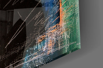 Angled view of glass wall art displaying abstract landscape with blue, green, orange, and black textured brushstroke patterns.
