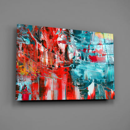 Abstract Reflection Glass Wall Art mounted on gray wall displaying vibrant red, turquoise, white, and yellow brushstrokes in expressionist style.