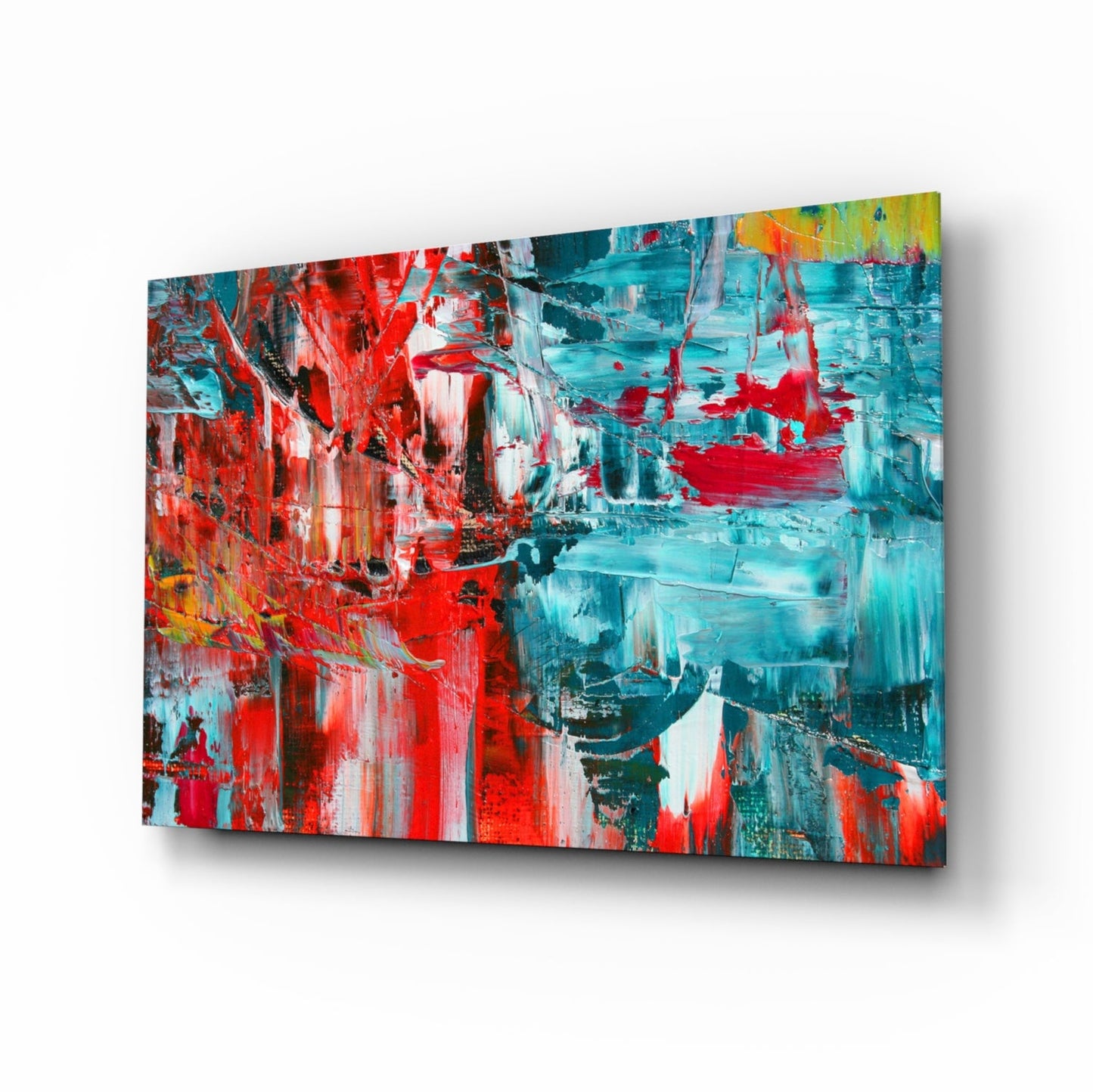 Angled view of abstract glass wall art featuring bold red, turquoise, and white brushstroke patterns with dark accents.