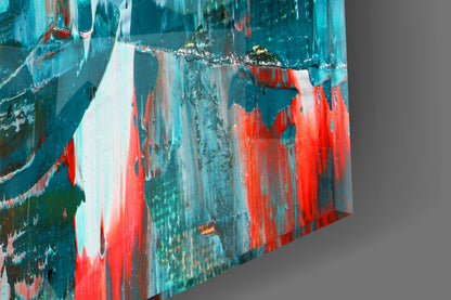 Abstract glass wall art panel displaying layered teal, red, and white brushstroke patterns at an angled perspective.