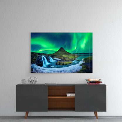 Northern Lights glass wall art displayed above gray mid-century credenza, showing green aurora borealis, mountain, waterfall, and snow.