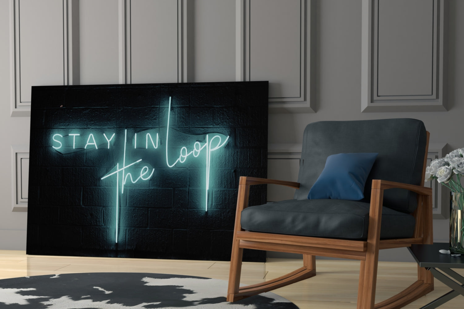 Cyan neon "Stay in the Loop" text glows on black glass panel displayed in modern living room with wooden chair and potted flowers.